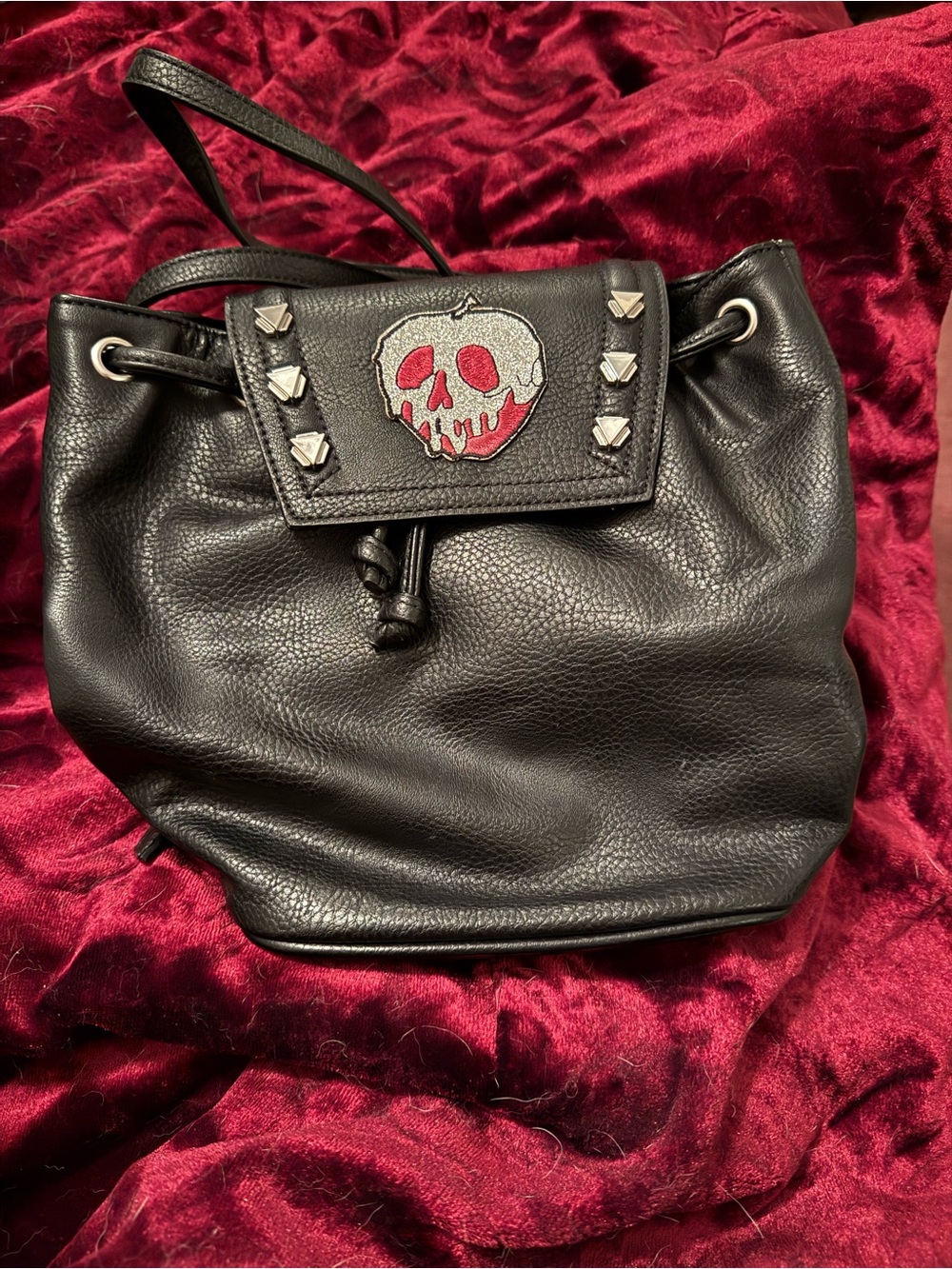 Danielle Nicole Studded Black Drawstring Backpack with Snow White Glitter Patch